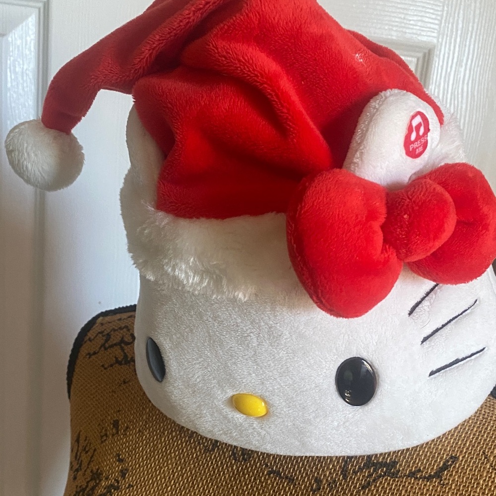 Hello Kitty singing /moving Festive Plush Red Santa Hat Sold for 59 EBay’s picts